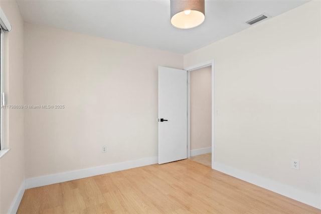 16791 Royal Poinciana Dr, Weston, FL 33326 - empty room with wood finished floors and baseboards