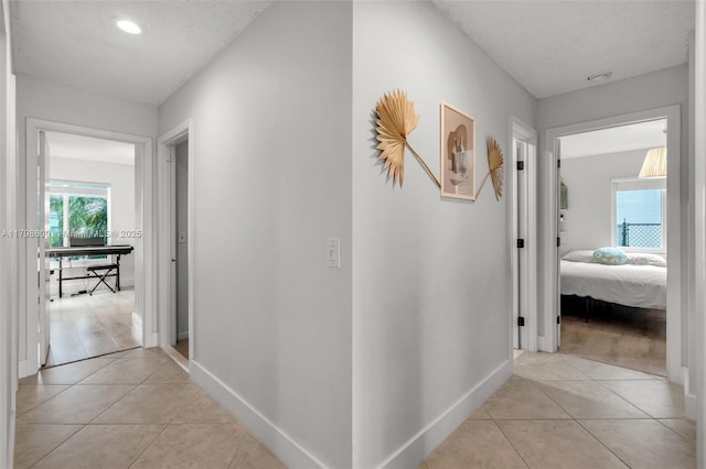 16791 Royal Poinciana Dr, Weston, FL 33326 - hall featuring light tile patterned flooring, baseboards, and recessed lighting