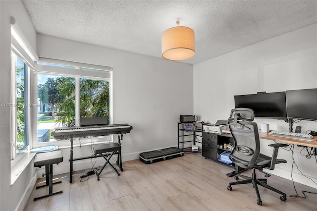 16791 Royal Poinciana Dr, Weston, FL 33326 - office featuring wood finished floors, plenty of natural light, and a textured ceiling