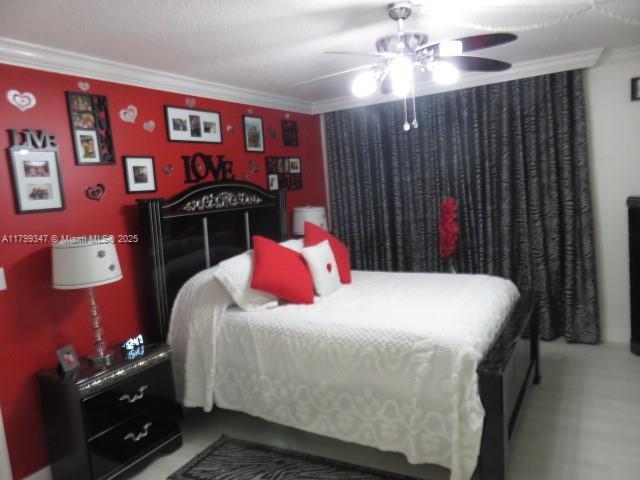 7040 SW 24th St Unit 104, Miami, FL 33155 - bedroom featuring ornamental molding and a ceiling fan