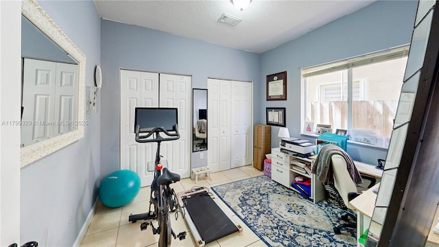 4114 NE 25th Ct, Homestead, FL 33033 - workout area featuring tile patterned floors and baseboards
