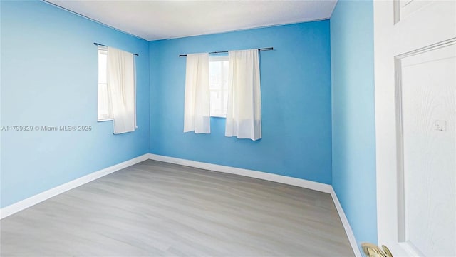 4114 NE 25th Ct, Homestead, FL 33033 - empty room with wood finished floors and baseboards
