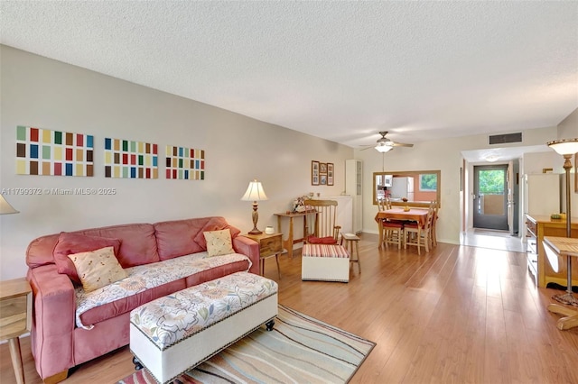 7080 Environ Blvd Unit 223, Lauderhill, FL 33319 - living room with a ceiling fan, wood finished floors, and a textured ceiling