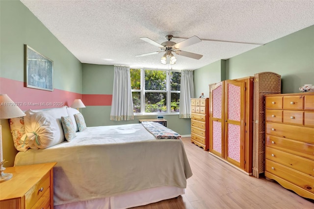 7080 Environ Blvd Unit 223, Lauderhill, FL 33319 - bedroom featuring wood finished floors, a textured ceiling, baseboards, and ceiling fan