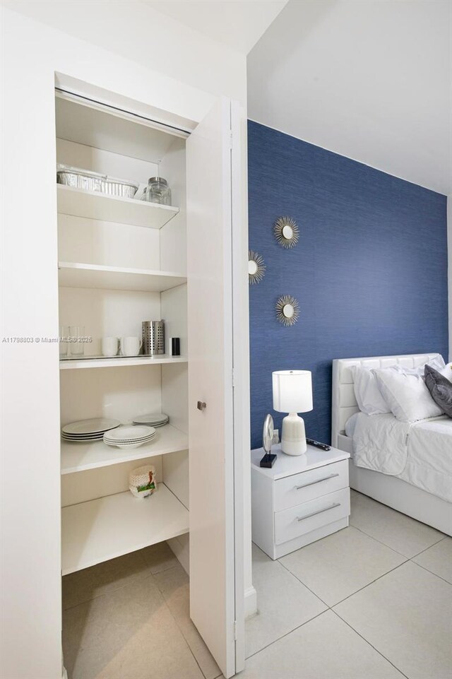 tiled bedroom with wallpapered walls