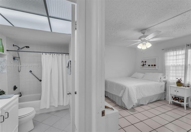 10451 Sunrise Lakes Blvd Unit 205, Sunrise, FL 33322 - bedroom with light tile patterned floors, a textured ceiling, and ceiling fan