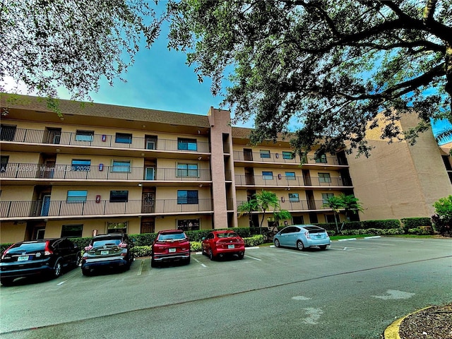 10451 Sunrise Lakes Blvd Unit 205, Sunrise, FL 33322 - view of apartment building / complex with uncovered parking