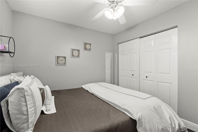 carpeted bedroom featuring a closet and a ceiling fan
