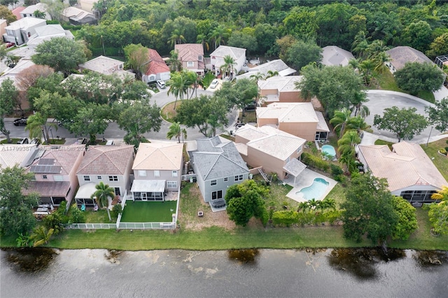 aerial perspective of suburban area with a nearby body of water