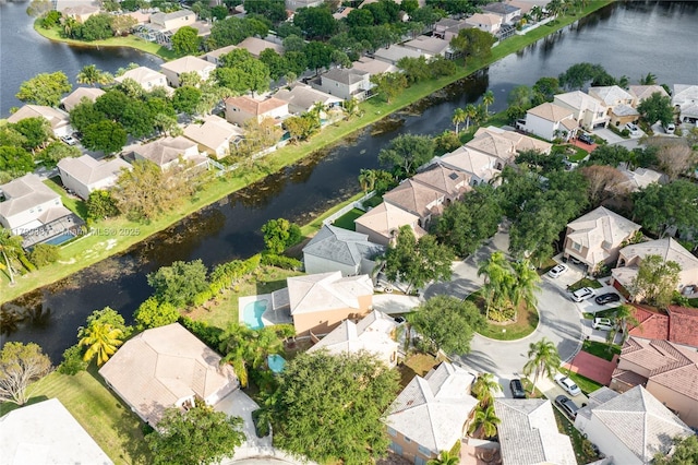 aerial view of residential area with a nearby body of water