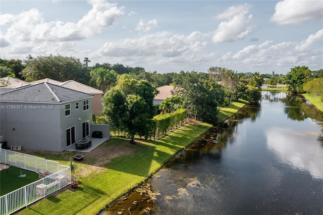 aerial view of property and surrounding area with a nearby body of water