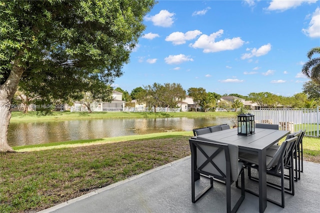 view of patio featuring outdoor dining space and a water view