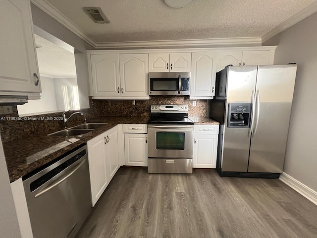 15711 SW 137th Ave Unit 201, Miami, FL 33177 - kitchen with stainless steel appliances, a sink, a textured ceiling, dark wood-style floors, and white cabinets