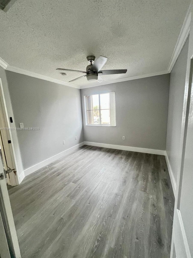 15711 SW 137th Ave Unit 201, Miami, FL 33177 - spare room with crown molding, ceiling fan, wood finished floors, a textured ceiling, and baseboards