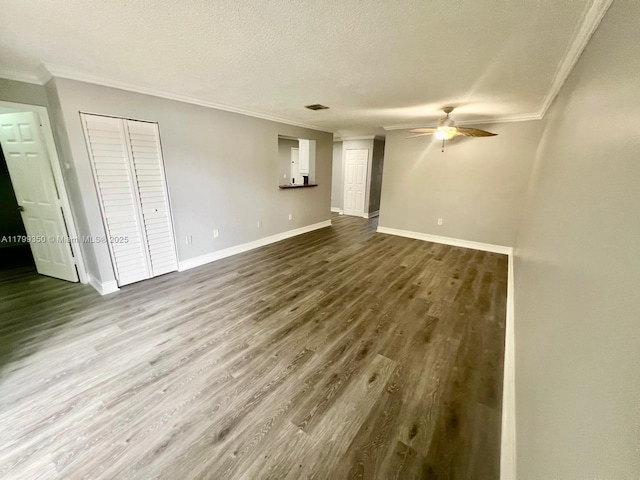 15711 SW 137th Ave Unit 201, Miami, FL 33177 - unfurnished living room with ornamental molding, ceiling fan, wood finished floors, baseboards, and a textured ceiling