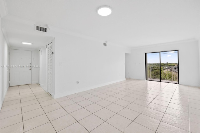 8401 NW 8th St Unit 401, Miami, FL 33126 - spare room with ornamental molding, light tile patterned flooring, and baseboards