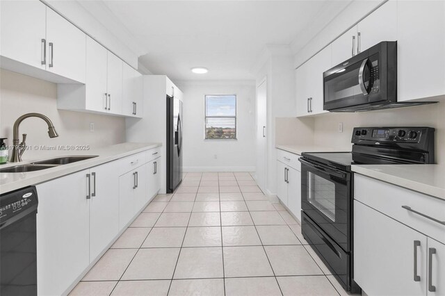 8401 NW 8th St Unit 401, Miami, FL 33126 - kitchen featuring black appliances, a sink, light countertops, white cabinets, and ornamental molding