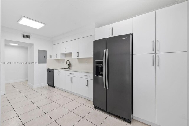8401 NW 8th St Unit 401, Miami, FL 33126 - kitchen with black appliances, a sink, light countertops, white cabinets, and light tile patterned floors