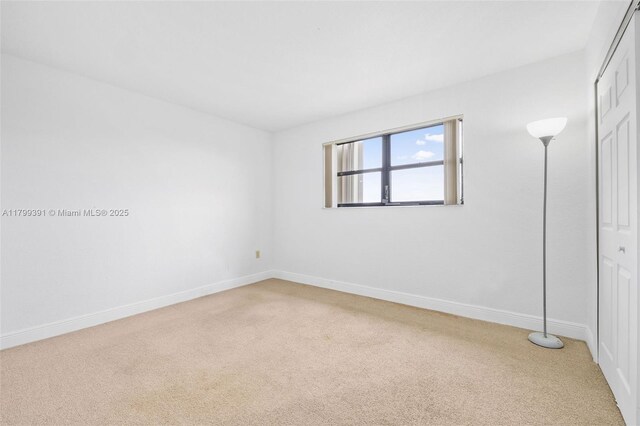 8401 NW 8th St Unit 401, Miami, FL 33126 - unfurnished room with light colored carpet and baseboards