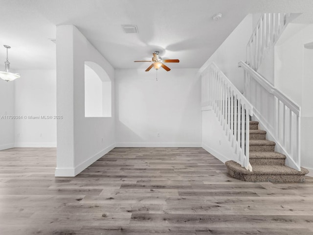 2482 SE 14th Ct, Homestead, FL 33035 - additional living space featuring ceiling fan, wood finished floors, baseboards, and stairway