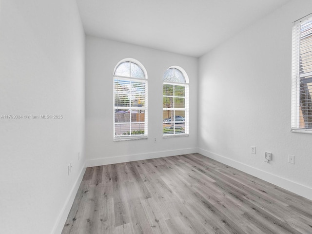2482 SE 14th Ct, Homestead, FL 33035 - empty room featuring wood finished floors and baseboards