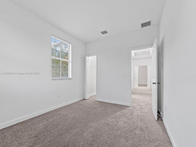 2482 SE 14th Ct, Homestead, FL 33035 - unfurnished bedroom featuring carpet floors and baseboards