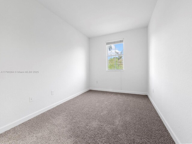 2482 SE 14th Ct, Homestead, FL 33035 - carpeted spare room featuring baseboards