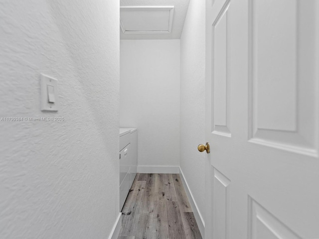 2482 SE 14th Ct, Homestead, FL 33035 - laundry area with independent washer and dryer, wood finished floors, and a textured wall