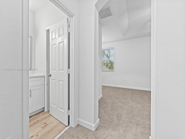 2482 SE 14th Ct, Homestead, FL 33035 - corridor with baseboards and light carpet