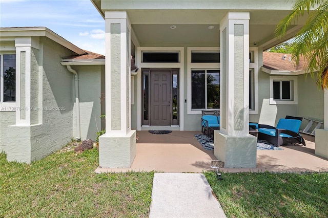 5514 NW W Lundy Cir, Port St Lucie, FL 34986 - entrance to property featuring stucco siding and a yard