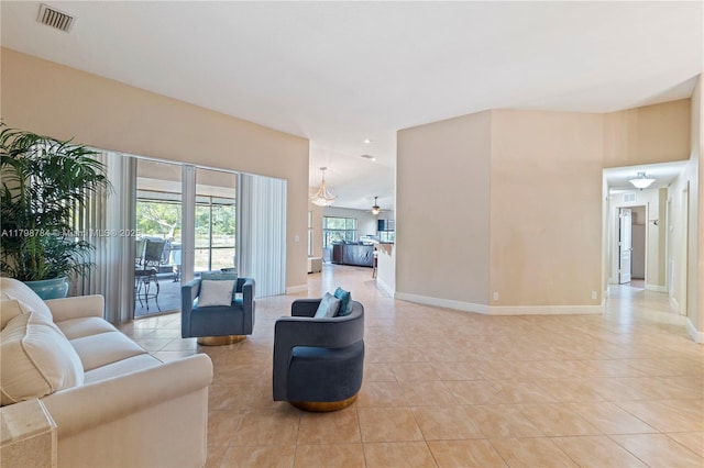 5514 NW W Lundy Cir, Port St Lucie, FL 34986 - living area featuring light tile patterned floors and baseboards