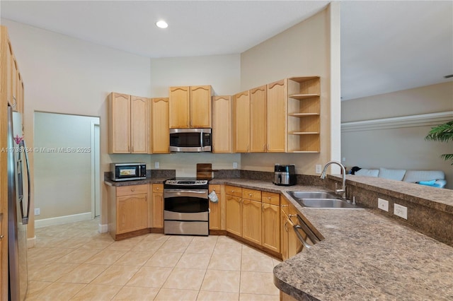5514 NW W Lundy Cir, Port St Lucie, FL 34986 - kitchen with appliances with stainless steel finishes, a sink, light brown cabinets, and light tile patterned floors