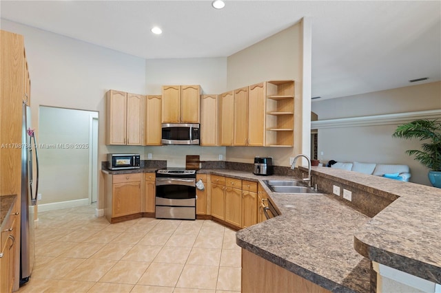 5514 NW W Lundy Cir, Port St Lucie, FL 34986 - kitchen featuring appliances with stainless steel finishes, a sink, light brown cabinets, light tile patterned flooring, and recessed lighting