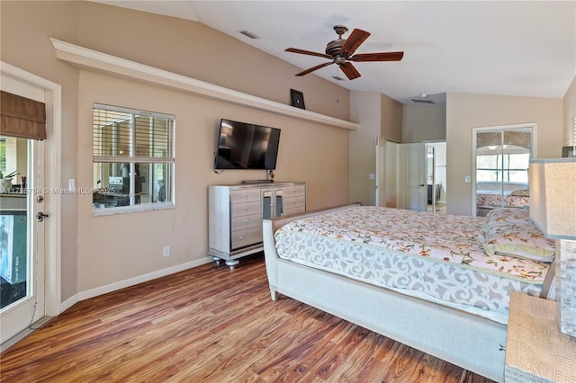 5514 NW W Lundy Cir, Port St Lucie, FL 34986 - bedroom with lofted ceiling, multiple windows, wood finished floors, baseboards, and a ceiling fan