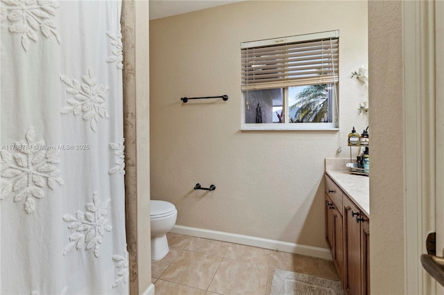 5514 NW W Lundy Cir, Port St Lucie, FL 34986 - full bathroom featuring vanity, toilet, baseboards, tile patterned floors, and a shower with curtain