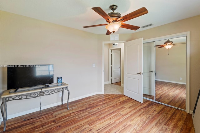 5514 NW W Lundy Cir, Port St Lucie, FL 34986 - living room with ceiling fan, light wood finished floors, and baseboards