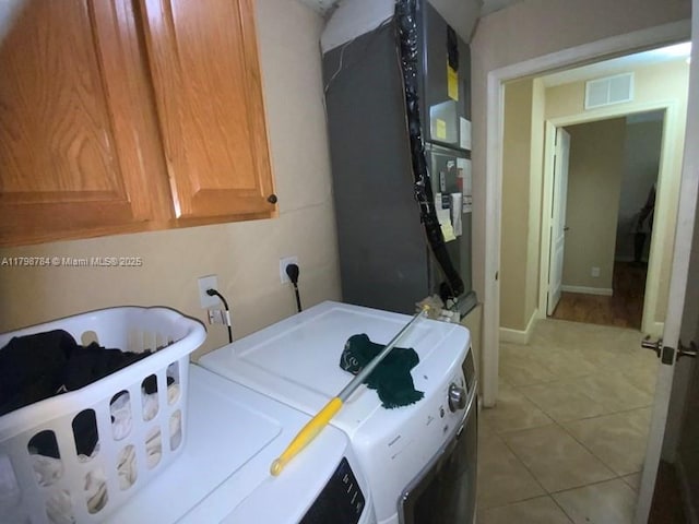 5514 NW W Lundy Cir, Port St Lucie, FL 34986 - washroom with independent washer and dryer, cabinet space, light tile patterned flooring, and heating unit