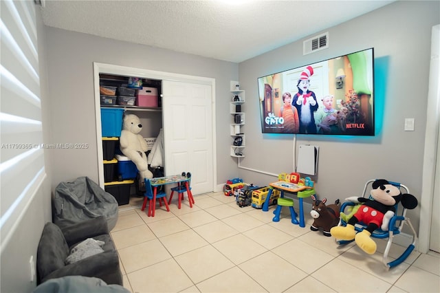6950 Miami Gardens Dr Unit 2-502, Hialeah, FL 33015 - recreation room featuring tile patterned flooring and a textured ceiling