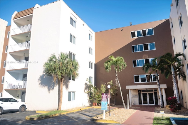 6950 Miami Gardens Dr Unit 2-502, Hialeah, FL 33015 - view of apartment building / complex with uncovered parking