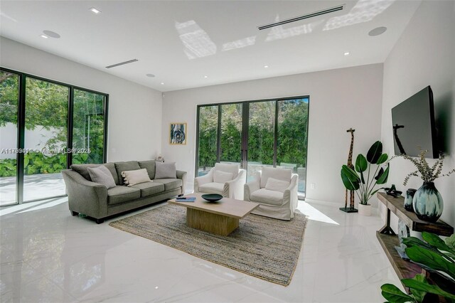 1780 Chucunantah Rd, Miami, FL 33133 - living room with marble tiled floors, plenty of natural light, and recessed lighting