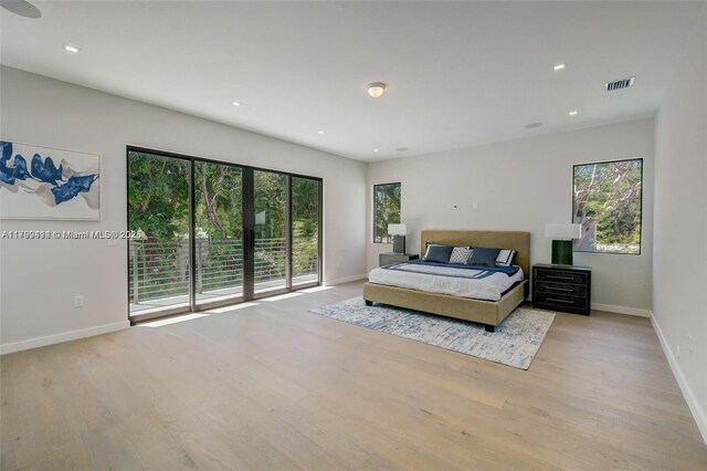 1780 Chucunantah Rd, Miami, FL 33133 - bedroom featuring multiple windows, wood finished floors, baseboards, and recessed lighting