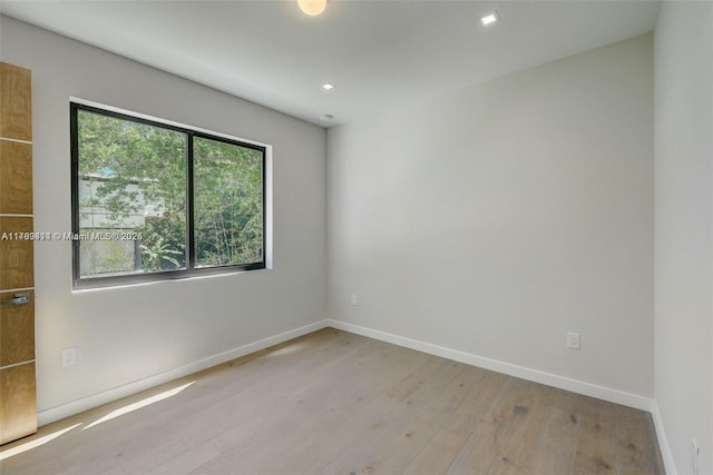 1780 Chucunantah Rd, Miami, FL 33133 - spare room with wood finished floors, baseboards, and recessed lighting