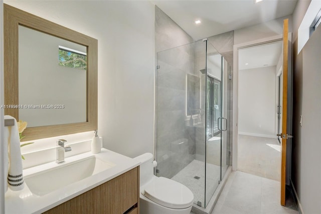 1780 Chucunantah Rd, Miami, FL 33133 - full bath with toilet, a shower stall, vanity, tile patterned floors, and recessed lighting
