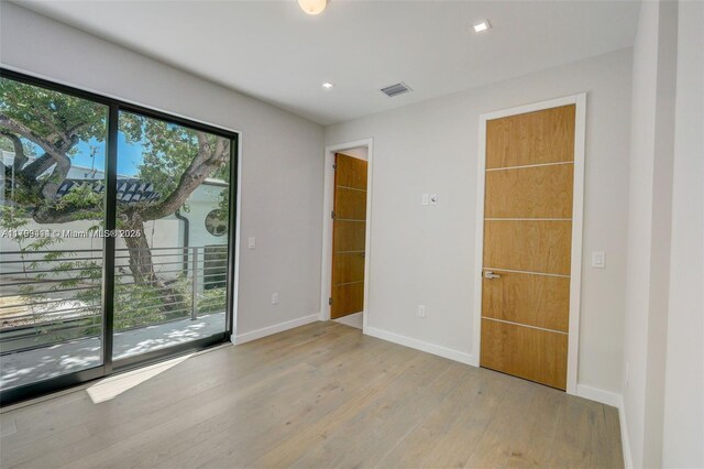 1780 Chucunantah Rd, Miami, FL 33133 - empty room with wood finished floors, baseboards, and recessed lighting