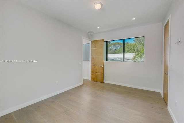 1780 Chucunantah Rd, Miami, FL 33133 - empty room with light wood finished floors, baseboards, and recessed lighting