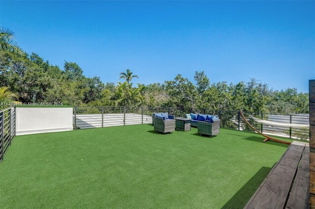 1780 Chucunantah Rd, Miami, FL 33133 - view of yard with an outdoor living space and fence