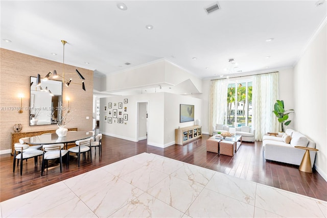 living area with ornamental molding, baseboards, wood finished floors, and recessed lighting