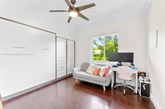 office area featuring wood finished floors, ornamental molding, ceiling fan, and baseboards