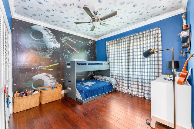 bedroom with hardwood / wood-style flooring and crown molding