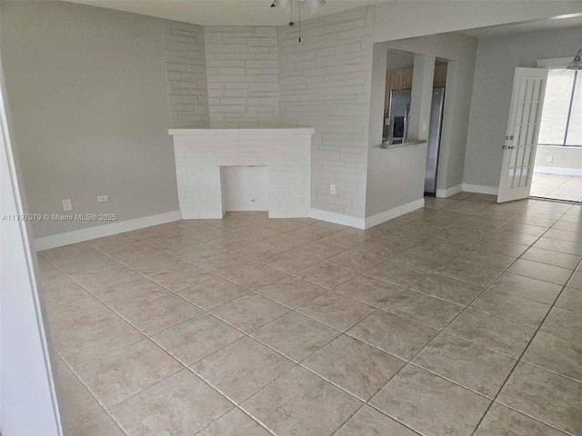 7917 Juniper St, Miramar, FL 33023 - unfurnished living room featuring tile patterned flooring, a ceiling fan, baseboards, and french doors